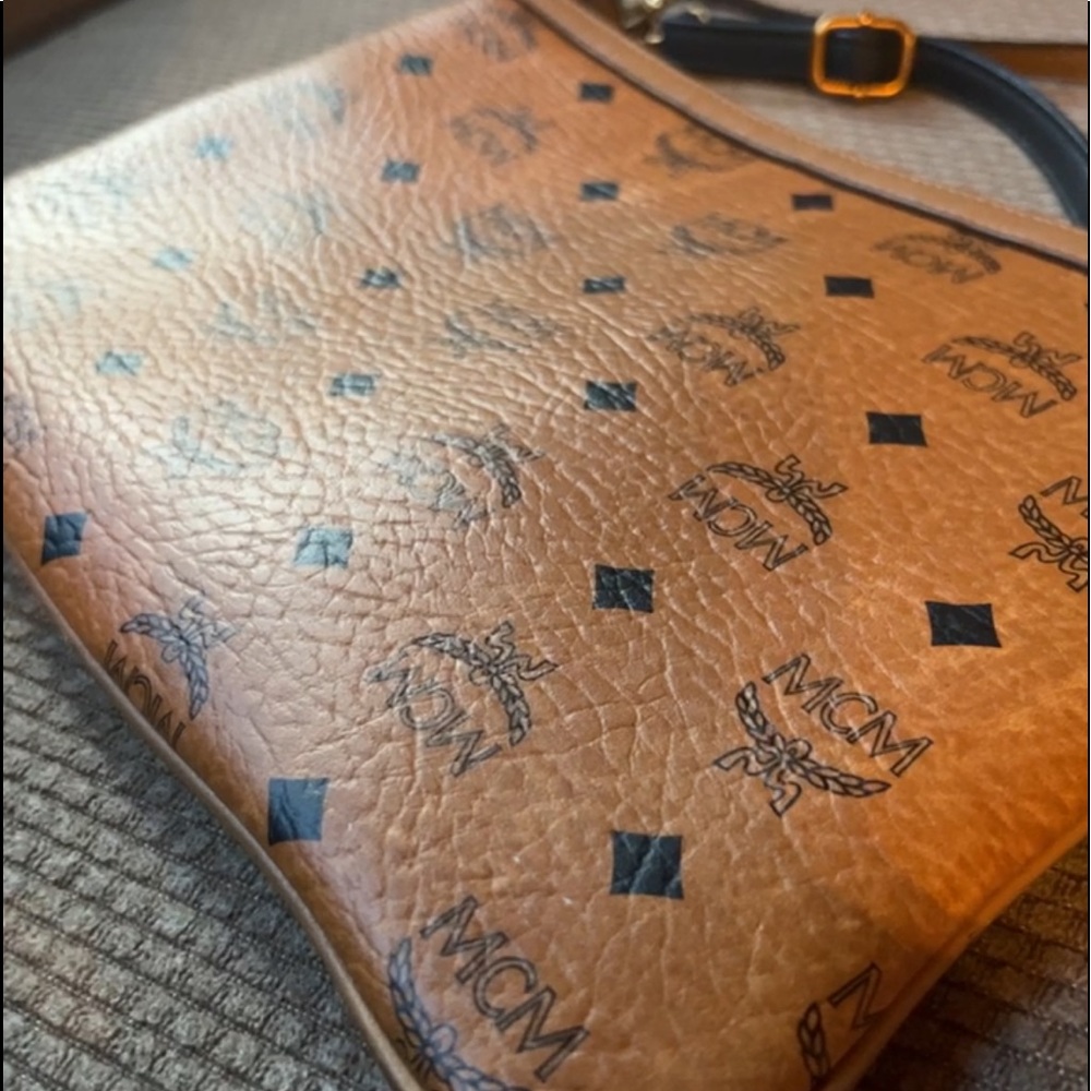 MCM authentic crossbody with 2 removable straps can be worn as a pouch or wallet